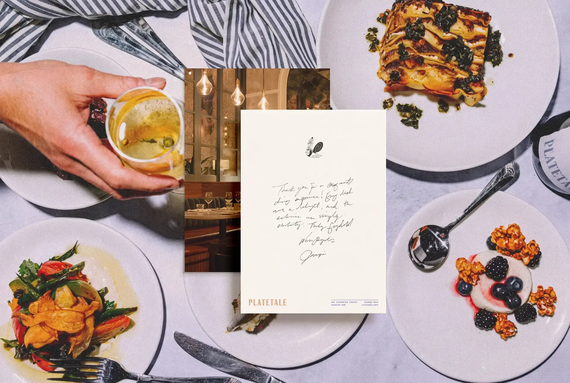 Overhead view of a shared PlateTale dinner table with plates, a handwritten note and cutlery